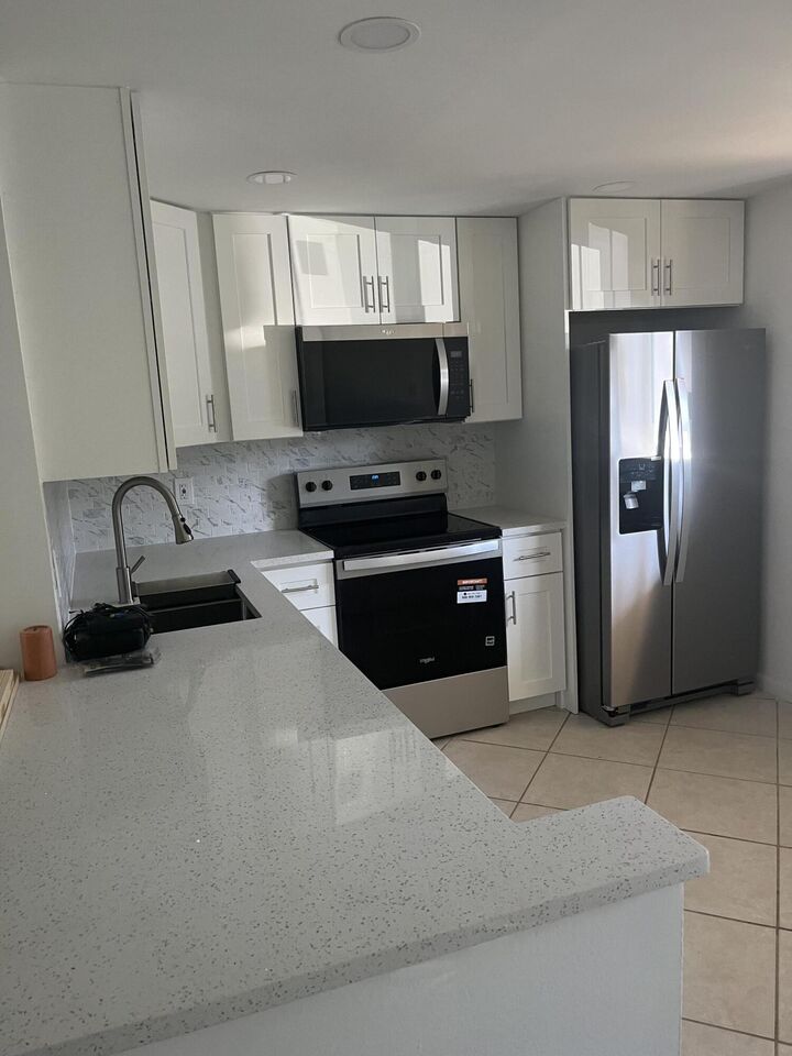 Property Photo:  2615 NE 3rd Court 103  FL 33435 