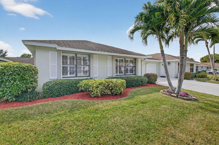 Property Photo:  9800 Tabebuia Tree Drive A  FL 33436 