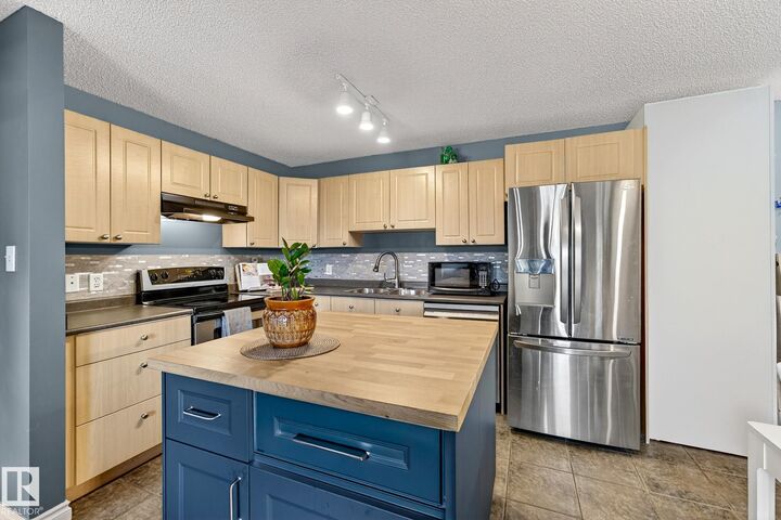 Property Photo: 70 Woodsmere 309 AB T8L 4R8