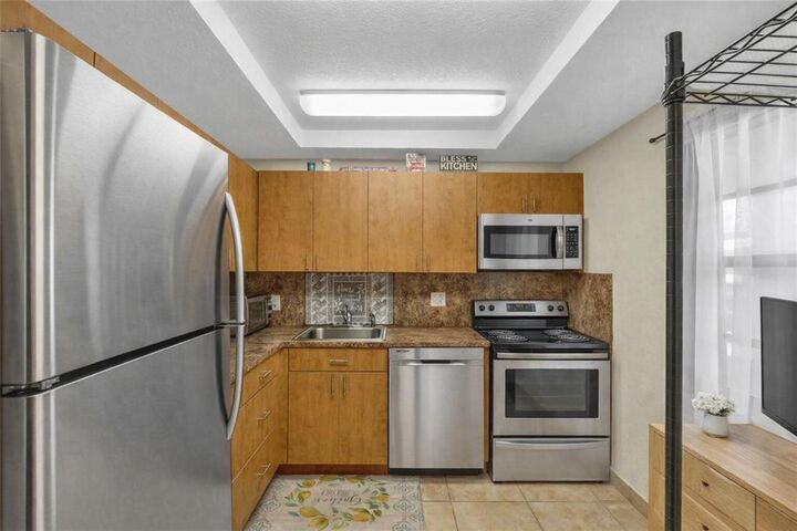 Property Photo:  1015 Country Club Drive 203  FL 33063 