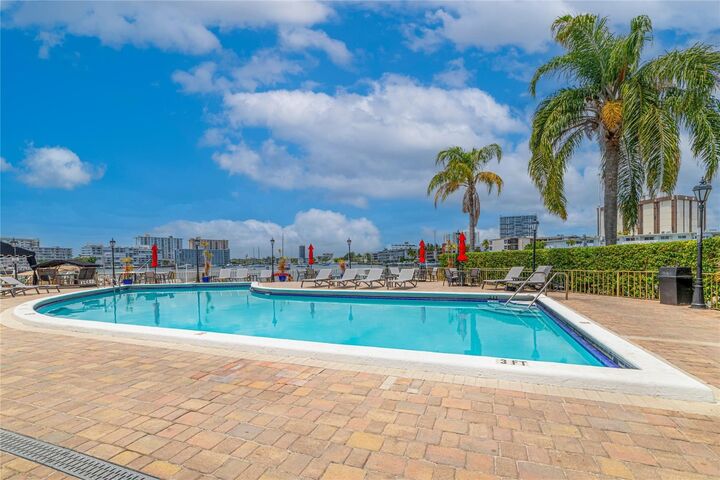 Property Photo:  100 Golden Isles Drive 911  FL 33009 