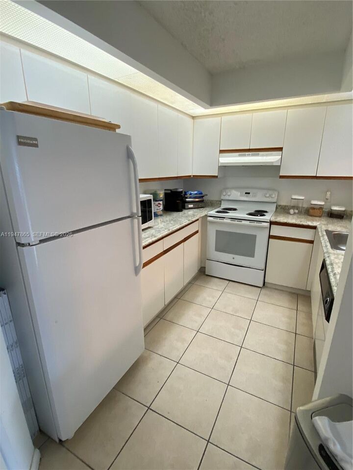 Property Photo:  12950 SW 7th Ct 310A  FL 33027 