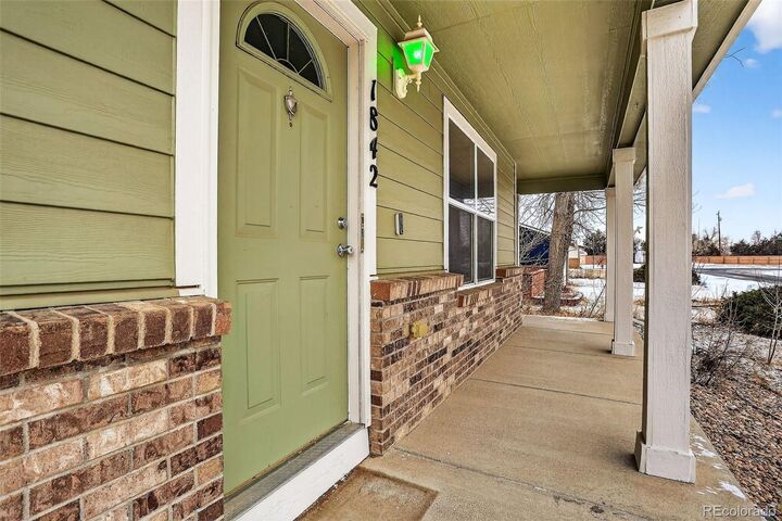 Property Photo: 1842 Ance Street CO 80136