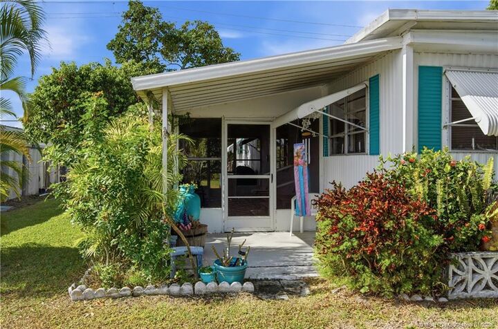 Property Photo:  7878 SE Swan Avenue  FL 33455 