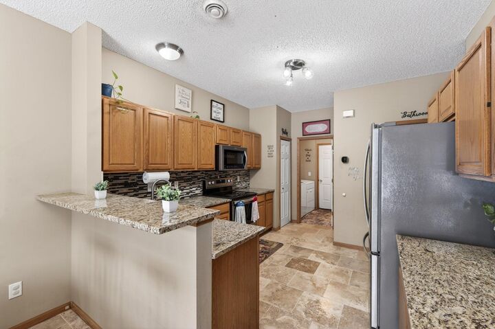 Property Photo: 6902 139th Lane NW 5 MN 55303