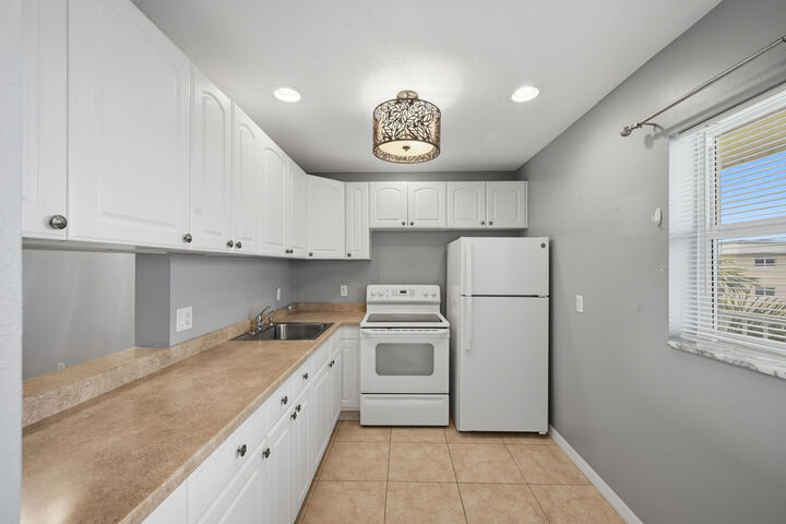 Property Photo:  130 NE 26th Avenue 4090  FL 33435 