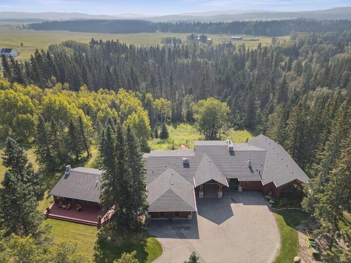 Property Photo:  226003 Priddis Valley Road W  AB T1S 5R2 