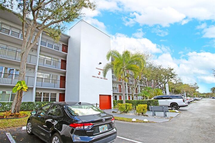 Property Photo:  1301 SW 135th Ter 413J  FL 33027 