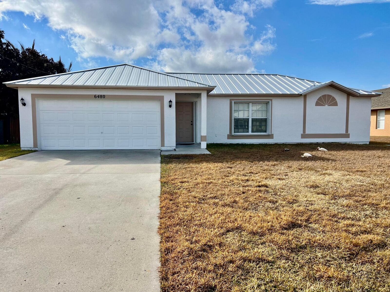 Property Photo:  6480 NW Volucia Drive  FL 34986 