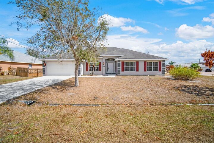 Property Photo:  6762 NW Daffodil Ln  FL 34983 