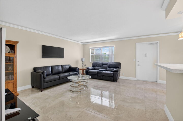 Property Photo:  205 Flanders E  FL 33484 