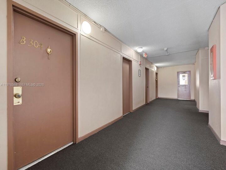 Property Photo:  6701 NW 169th St B304  FL 33015 