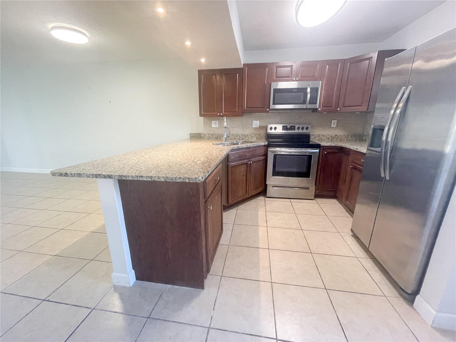 Property Photo:  2625 State Road 590 1211  FL 33759 