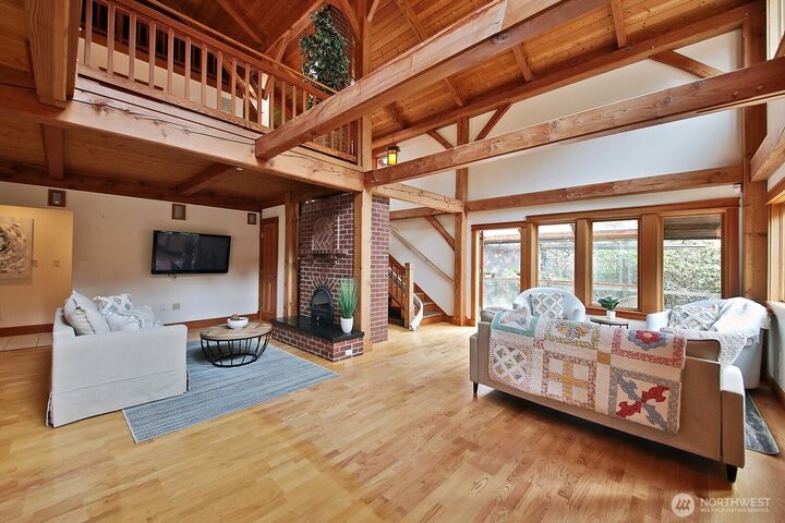 Interior image highlighting timber-frame craftsmanship and warm character inside the Greenbank home
