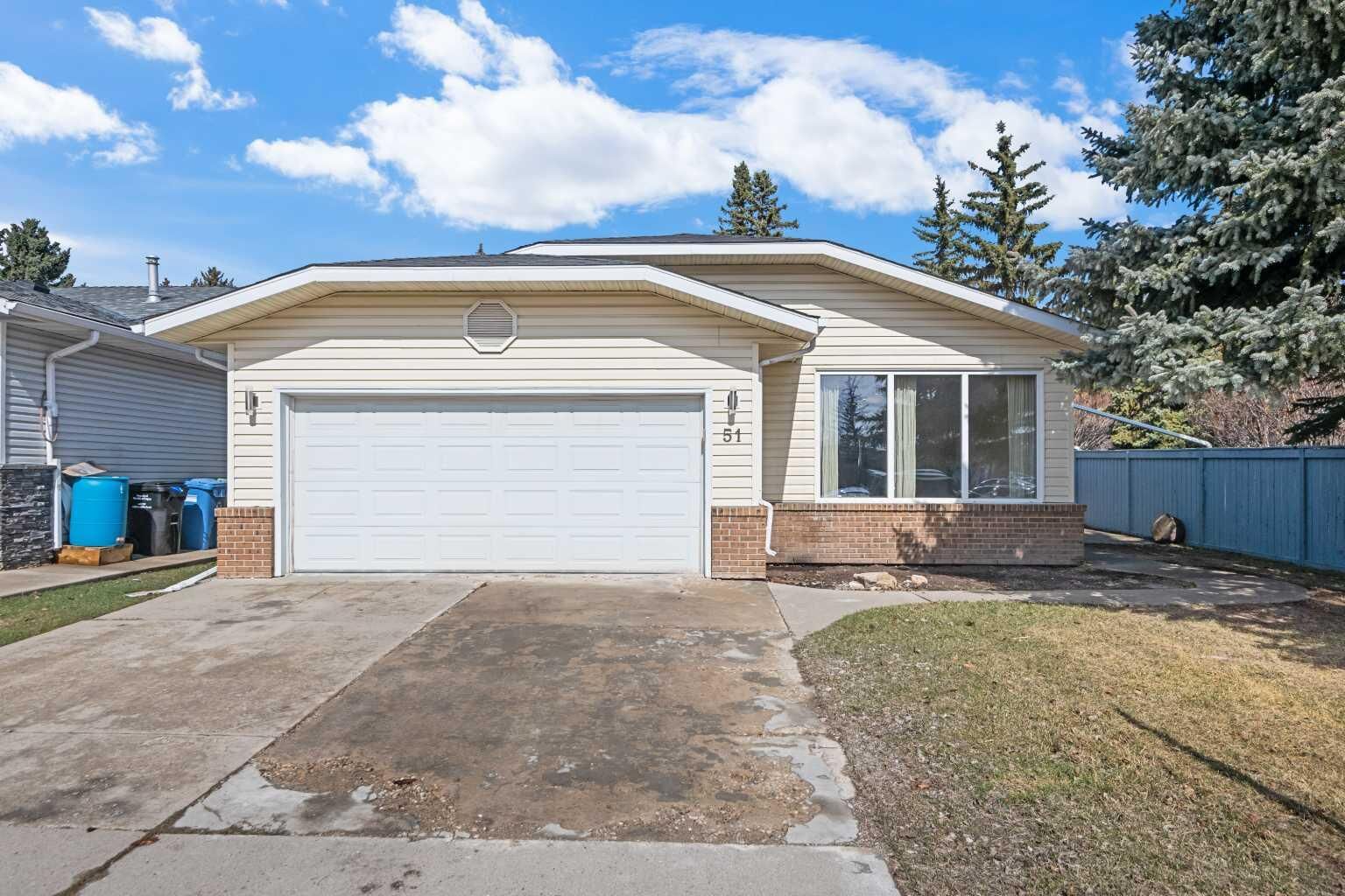 Property Photo:  51 Woodmont Road SW  AB T2W 4L6 