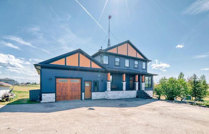 Property Photo: 240076 Paradise Meadow Drive AB T1X 0M8