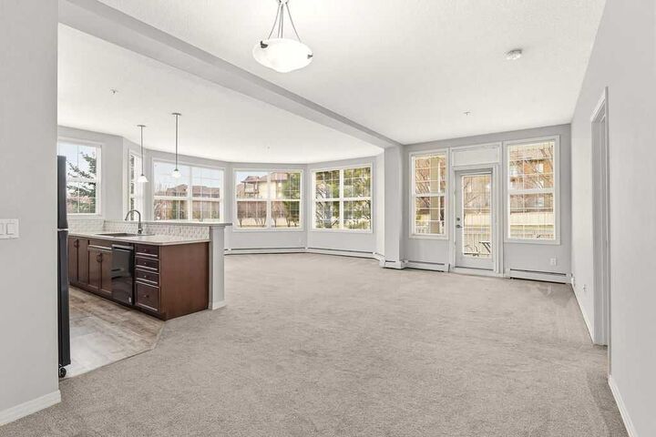 Property Photo:  1 Crystal Green Lane 137  AB T1S 0C5 