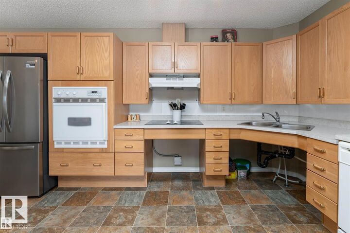 Property Photo: 16303 95 Street NW 221 AB T5Z 3V1