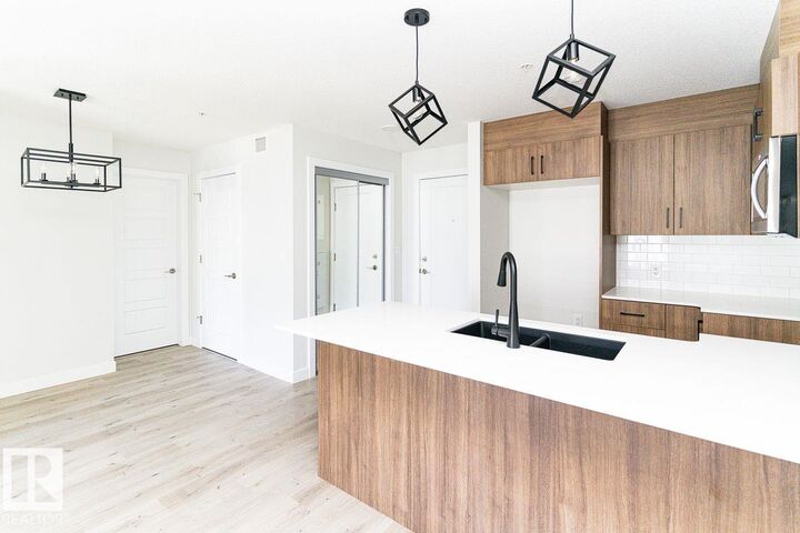 Property Photo: 2225 44 Avenue NW 204 AB T6T 0W5