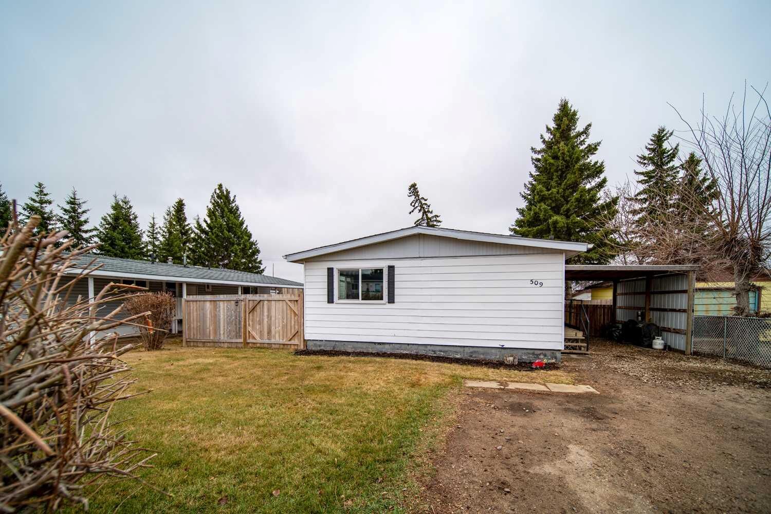 Property Photo:  509 2 Avenue Crescent  AB T9W 1A3 