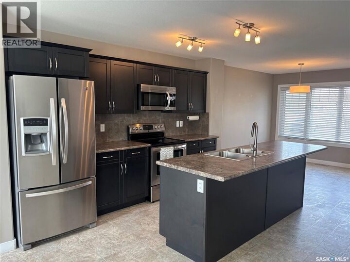 Property Photo:  4501 Green Poplar Lane E  SK S4V 3A5 
