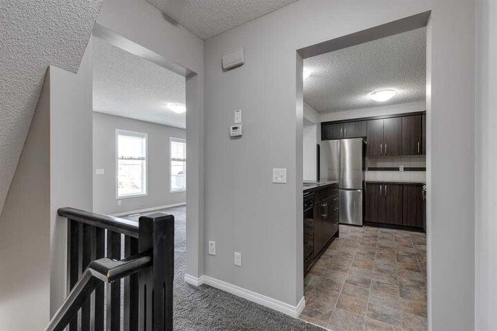 Property Photo:  113 Windstone Avenue SW  AB T4B 3R3 