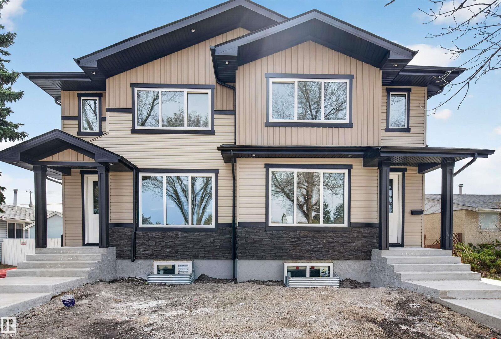 Property Photo:  10707-09 128 Avenue NW  AB T5E 0J4 