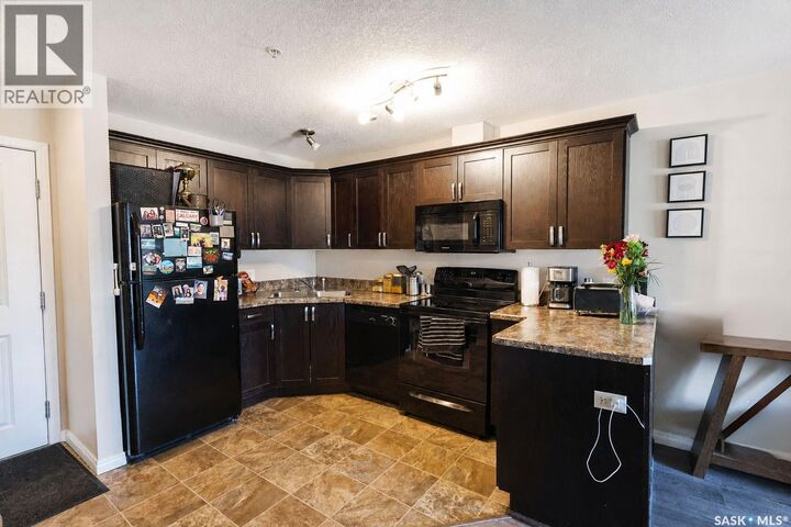 Property Photo:  102 1501 15th Street E  SK S6V 7C3 