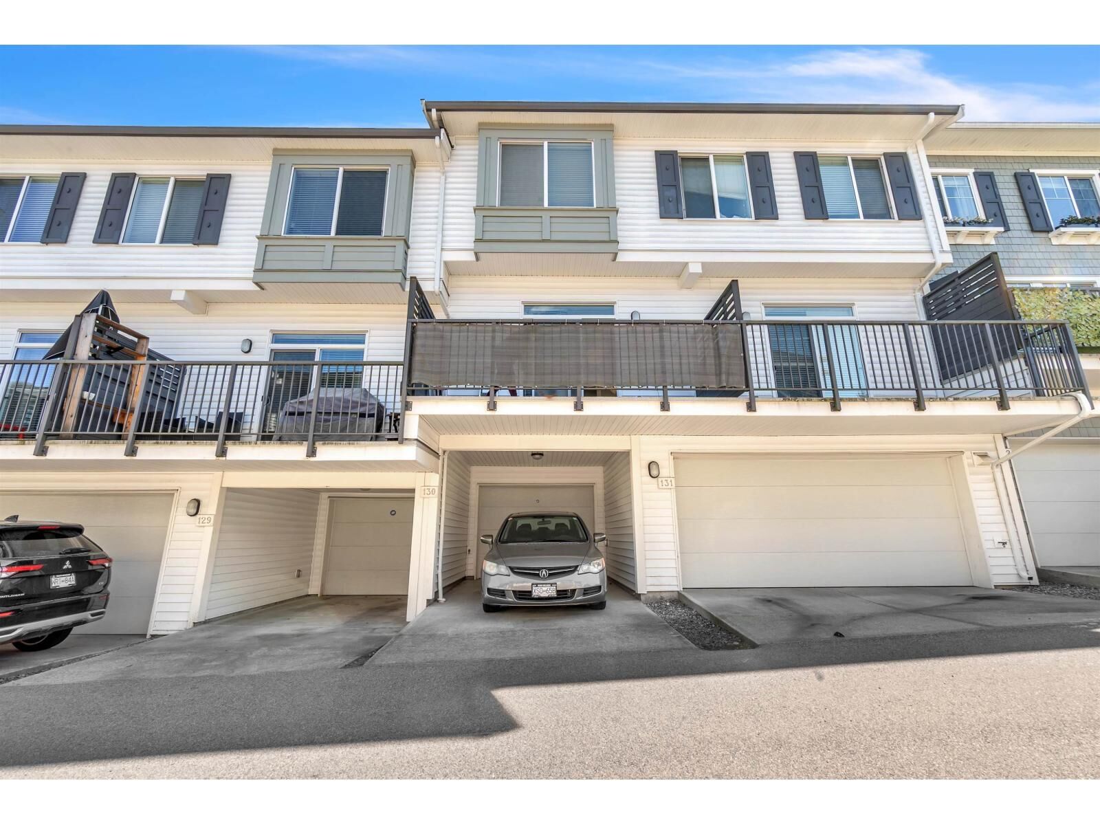 Property Photo: 8130 136A Street 130 BC V3W 1H9