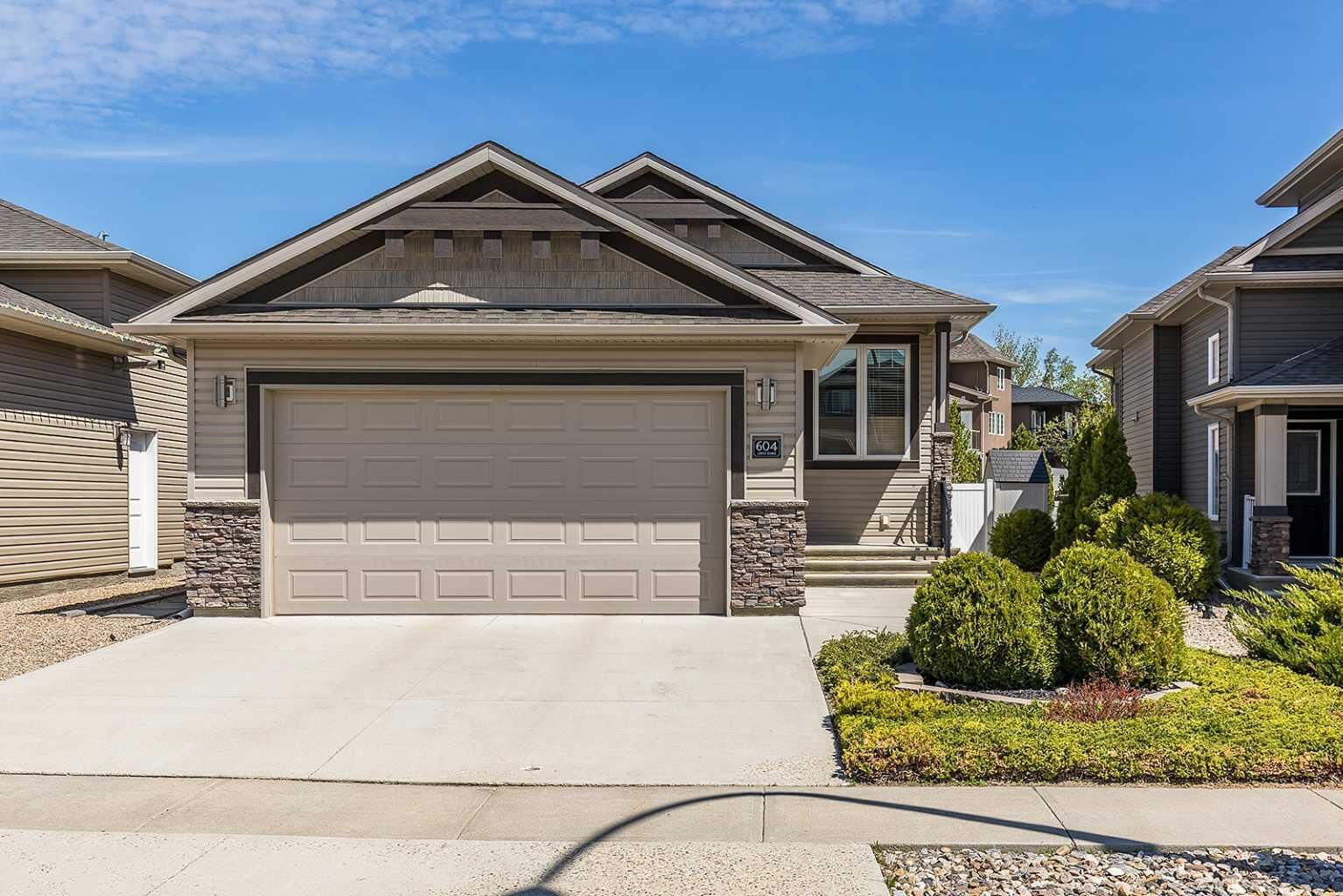 Property Photo:  604 Vista Drive SE  AB T1B 0N1 