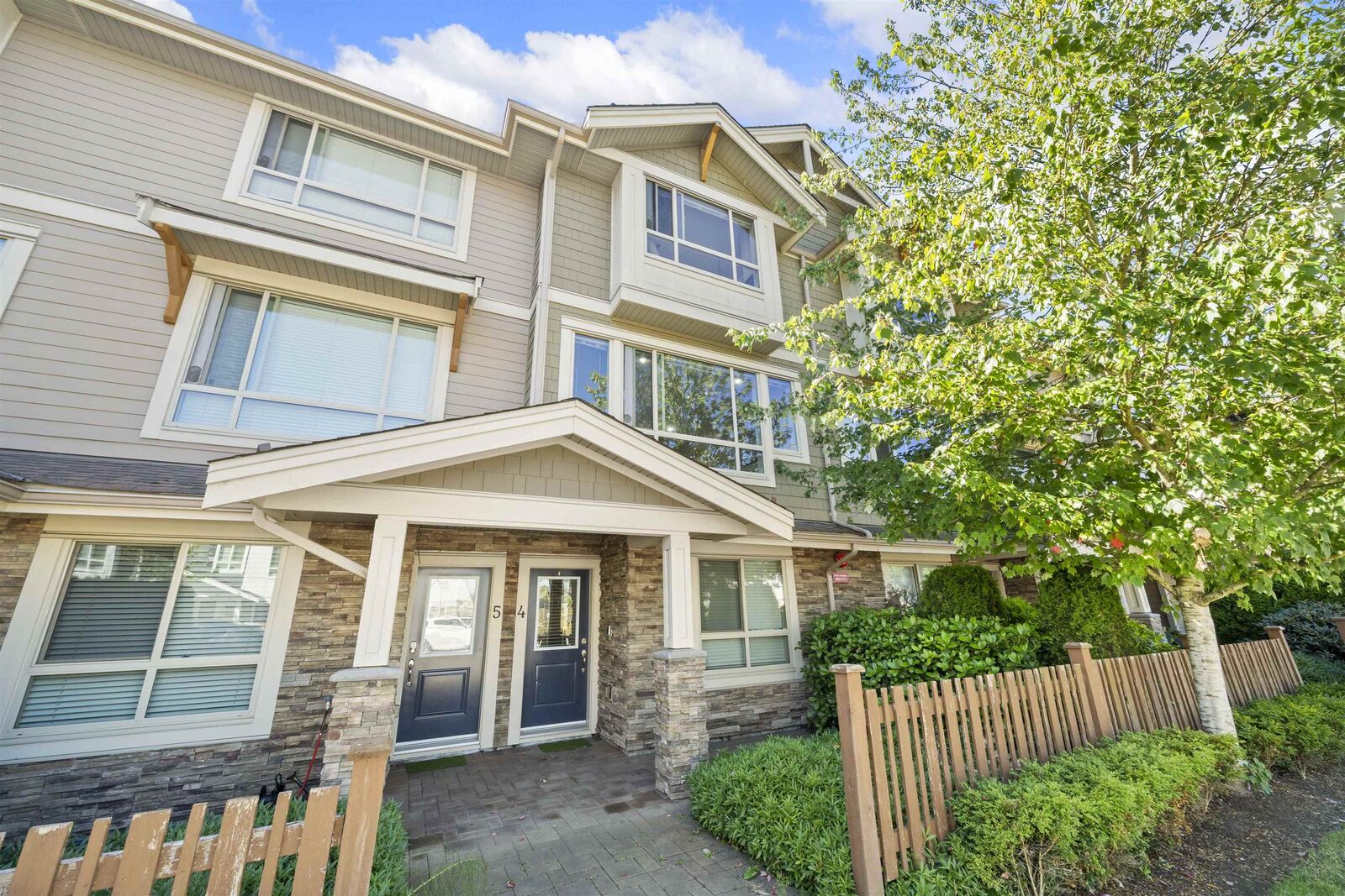 Property Photo: 19752 55A Avenue 4 BC V3A 3X2