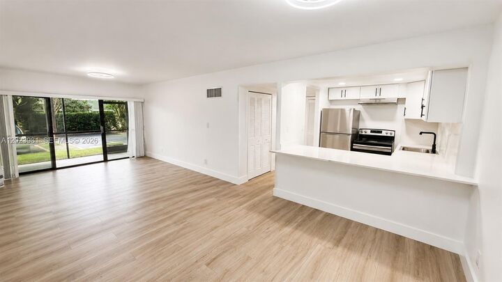 Property Photo:  5845 Washington St 65  FL 33023 