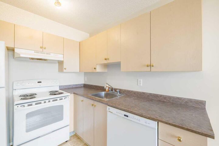 Property Photo: 1717 60 Street SE 113 AB T2A 7Y7