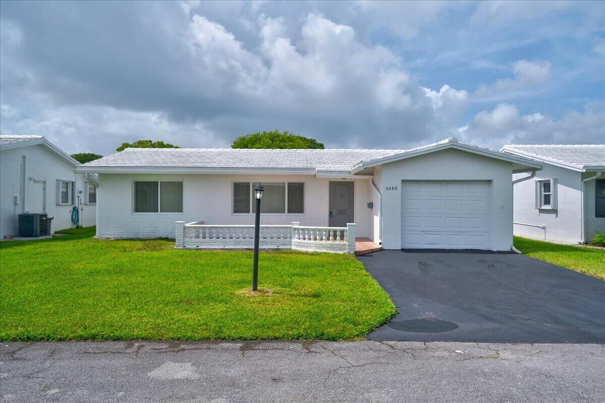 Property Photo:  2086 SW 12th Avenue  FL 33426 