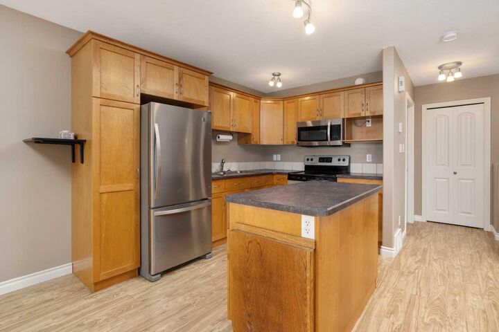Property Photo: 4915 45 Street 201 AB T4V 1E3