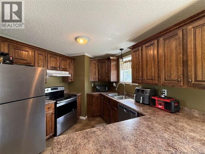 Property Photo:  678 Toussaint Road  NB E7B 2T8 