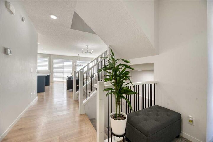 Property Photo:  125 Belmont Villas SW  AB T2X 4N5 