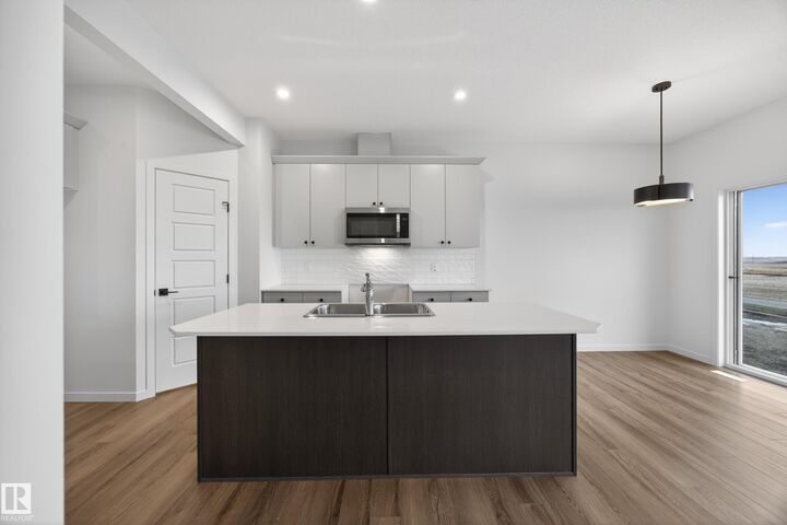 Property Photo: 116 Honeysuckle Green AB T9E 0V1