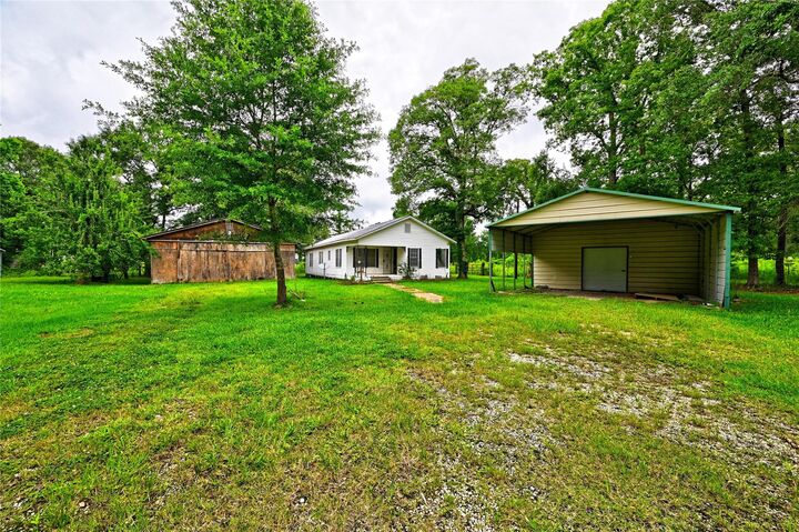 Property Photo: 1083 County Road 3141 TX 77327