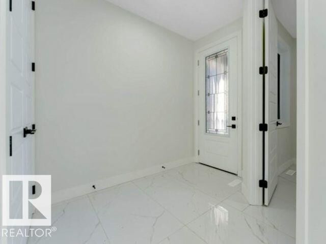 Property Photo:  7156 177 Avenue NW  AB T5Z 0W9 