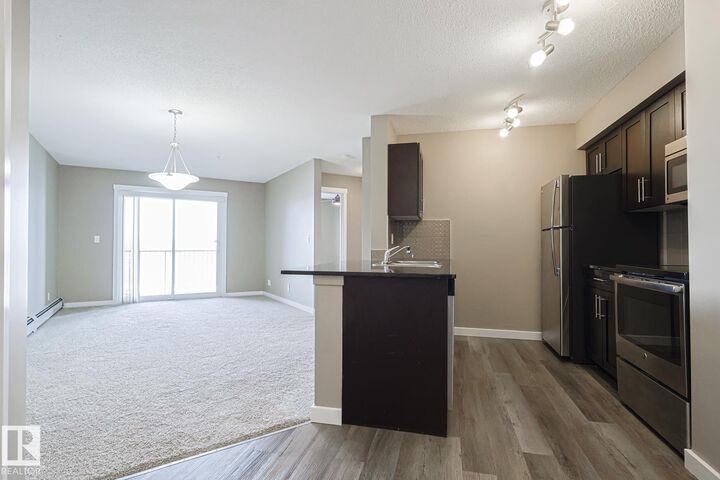 Property Photo: 1510 Watt Drive SW 313 AB T6X 2E6