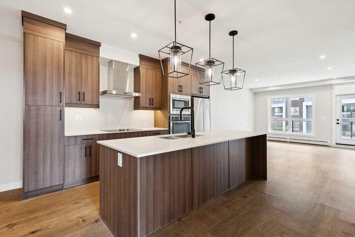 Property Photo:  1802 Mahogany Boulevard SE 7121  AB T3M 4A5 