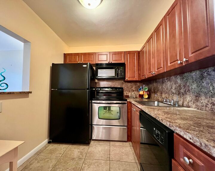 Property Photo:  142 Cambridge F  FL 33417 