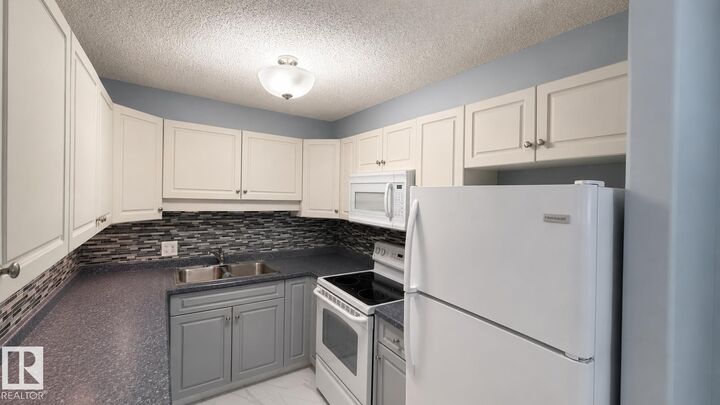 Property Photo: 13635 34 Street NW 202 AB T5A 0C4