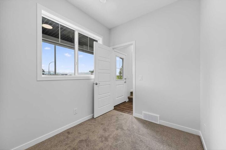 Property Photo: 28 Red Embers Plaza NE 203 AB T3N 2W1