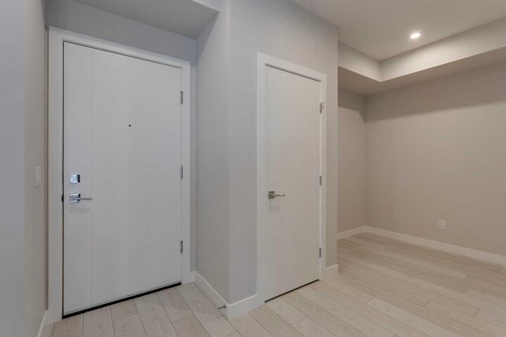 Property Photo: 8370 Broadcast Avenue SW 206 AB T3H 6L3