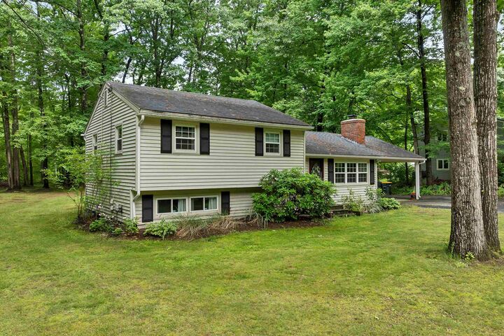 Property Photo: 64 Woodvale Drive NH 03246