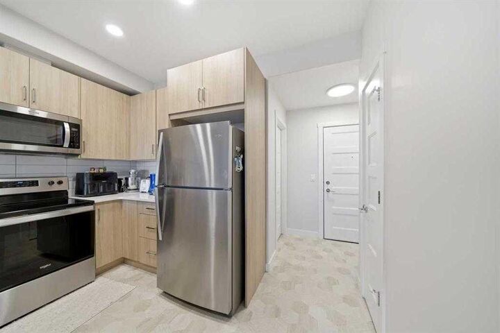 Property Photo:  55 Wolf Hollow Crescent SE 318  AB T2X 5K9 