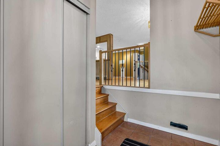 Property Photo:  130 Woodbrook Way SW  AB T2W 4R6 