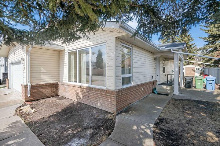 Property Photo: 51 Woodmont Road SW AB T2W 4L6
